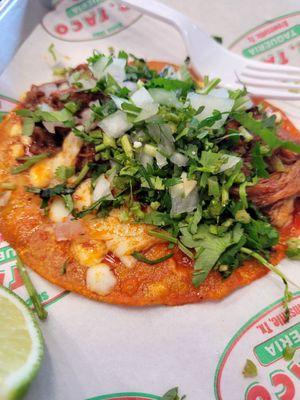 Taco de birria de res.  Cheesy, greasy, yummy.