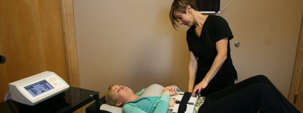 A patient is enjoying her relaxing, care free, painless laser lipo session.