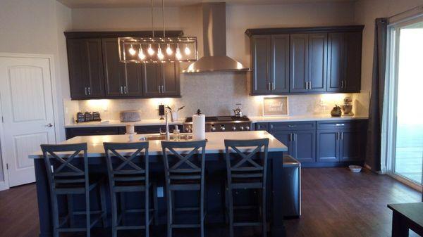 A beautiful new kitchen with cabinets and quartz countertops