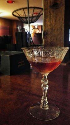 A custom brandy-cassis-amaretto cocktail that was built to perfection.