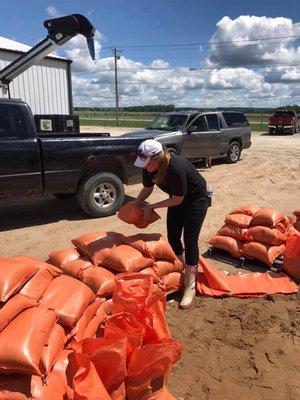 Jessica, with PuroClean sand bagging in Elsberry during Flood season.