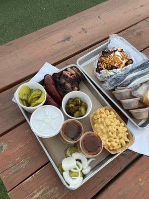 Too much food! Mac & Cheese, sausage, brisket and a LOADED bake potato.