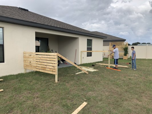 In this picture I was making a Wood fence for my client