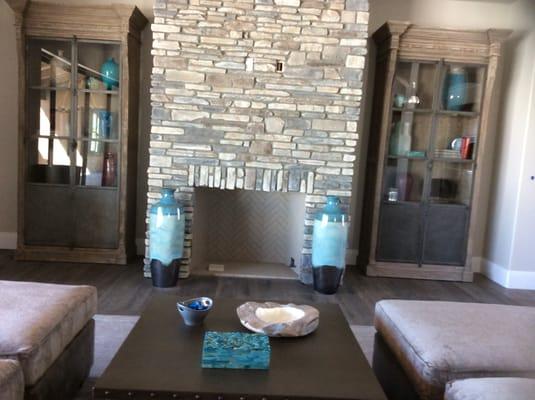 Fabulous metal and glass cabinets, expertly installed, custom sectional in leather and chenille and great coffee table: thank you Davis!!