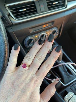 Matte black Dip with tip I love them A couple rhinestones fell off but, they fixed and replaced them