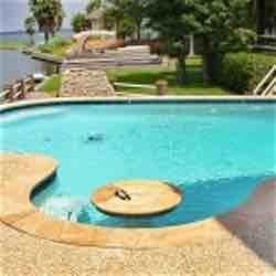 Geometric pool with table and spa.