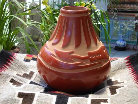 Beautiful Redware pottery from Santa Clara Pueblo, Navajo Rug.