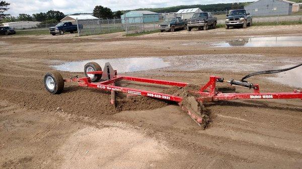 6ft wide ECO Grader being used with a pickup in two wheel drive.