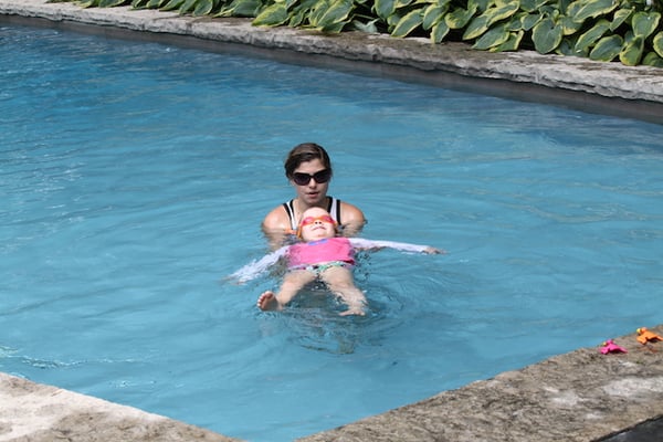 Instructor Bree teaching her student how to float