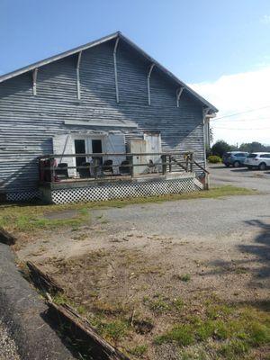 This is where you enter. I went around the back, and entered through the red door. That's the one the psychics enter