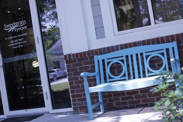 Look for our blue bench and enjoy the shade of the magnolia trees.