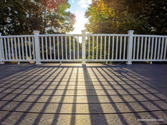 Composite deck and railing installed on a flat roof.