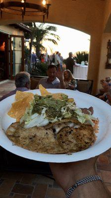 Corn tortilla steak quesadilla with a side of fresh guacamole and freshly made tortilla chips