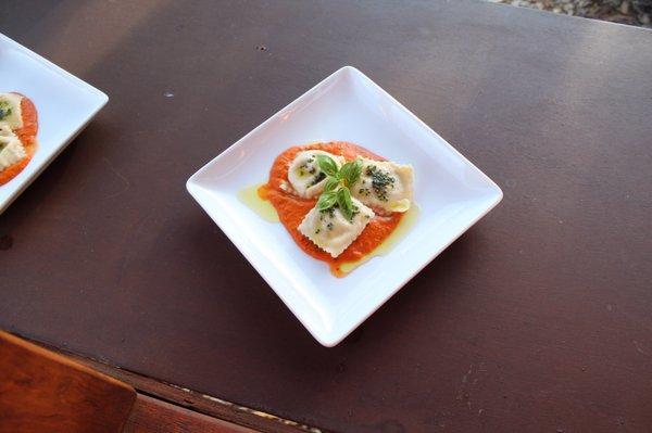 Homemade ham & béchamel Ravioli with a tomato herb cream sauce and rich sage butter