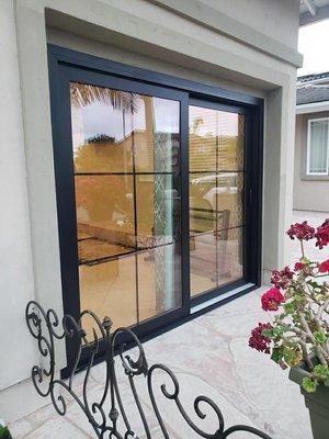 Black vinyl exterior patio door with flat grids for a clean look.