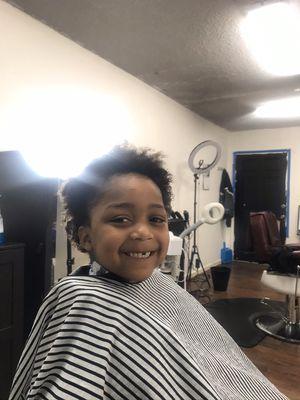 First haircut!!! All smiles (before he hears the clippers)