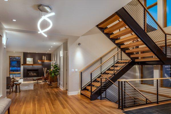 Art lighting on the walls, recessed can lighting, LED tape lighting in the mantle and of course the spectacular modern chandelier.