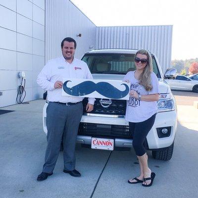 Camille Boutwell with her new 2017 Nissan Armada! With Beau Moore our General Sales Manager. Helping us kick off movember!