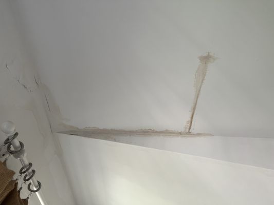 Water Damaged ceiling underneath the solar panel