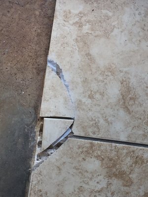 Broken tile "fixed" with tape (?)