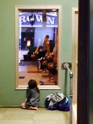 First Day in College Hill...Francesca looking through watching Daddy teaching yoga class.