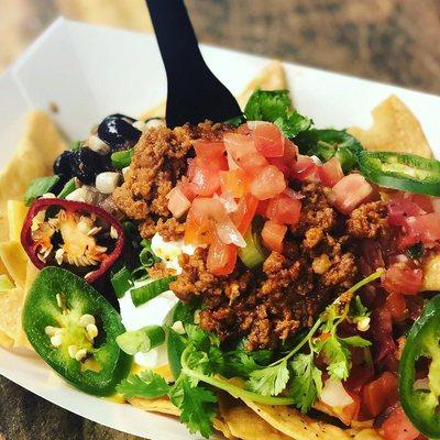 Loaded nachos with Chorizo, queso and more.