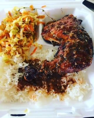 Jerk chicken with white rice and side of steam vegetables