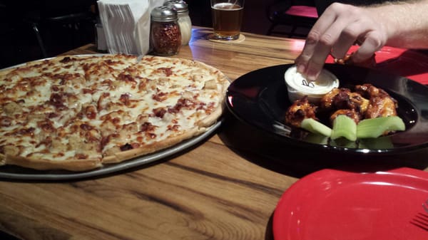 Can't keep your hands off. Wings and buffalo chicken pizza