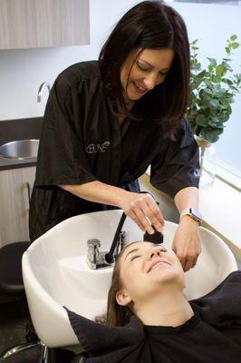 A relaxing shampoo experience with a scalp massage and a heated towel.