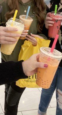 Thai tea with mango boba, strawberry tea with tapioca, mango tea with mango boba, pineapple frozen with mango boba