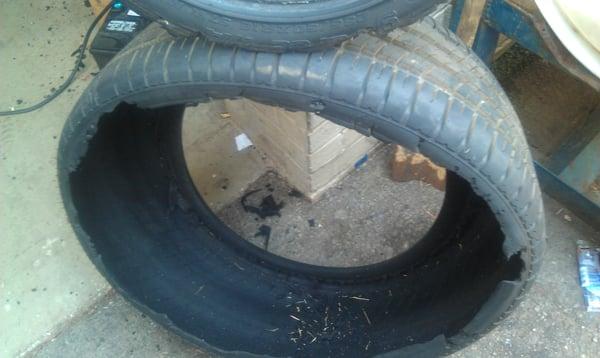 Tire after it blew out. It had less than 30 miles on it.