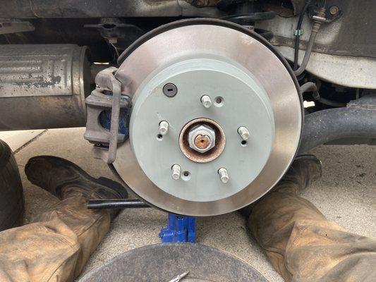 New brake pads, and rotors in a customers car.