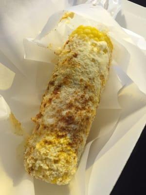 Elote (corn) on a stick Mexican style! Butter, mayo, crumble cheese , chili pepper! Delish!