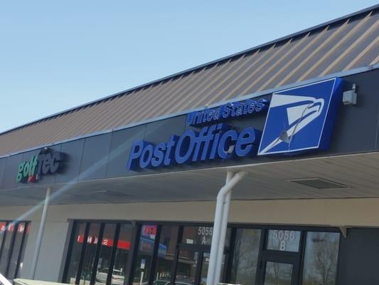 Post Office sign on strip mall awning