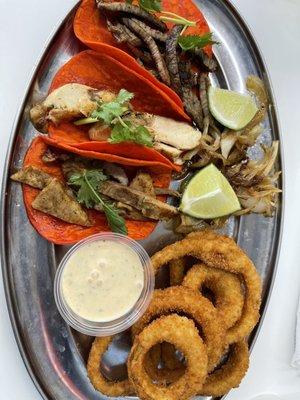 three tacos (chicken, beef, al pastor) and onion rings