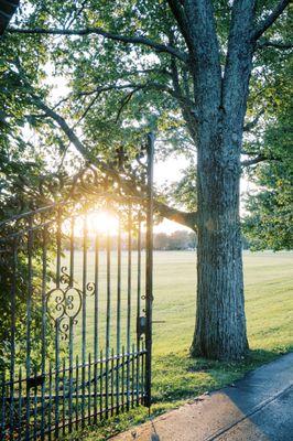 Front iron gate and sunset and Bryn Du Mansion