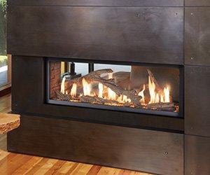 Stunning see-thru gas fireplaces with driftwood...perfect for that coastal vibe!