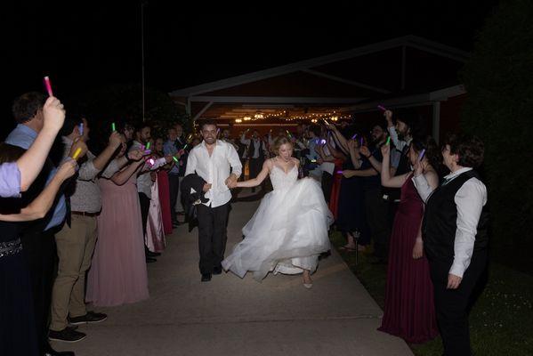 Our grand exit as the DJ played "This Will Be An Everlasting Love" and our guests waved glow-sticks.