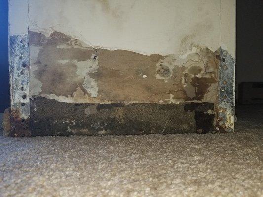 Wall that caved in due to mold and moisture