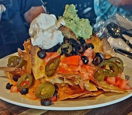 Nachos with house chips made fresh every day. The toppings were generous and the guacamole oh so delicious.