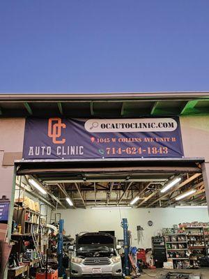 Front of Garage with shop sign overhead