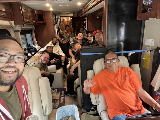 Tour bus with the take me back tour band