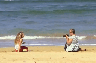 Rhonda and one of her clients in a photography session at the beach on Kauai.