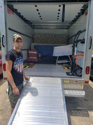 Nick a team member starting to load a 24FT Truck.