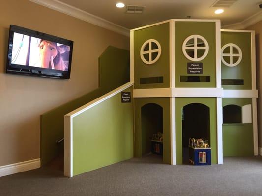 Playhouse with slide in the waiting room