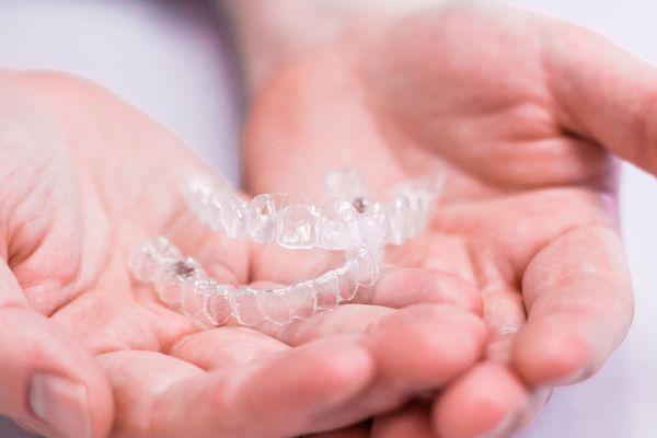 Discover the clear path to a beautiful smile with Invisalign clear aligners.