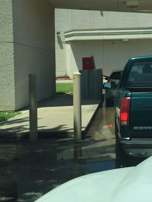 Permanent lake at the bottom of the drive thru ATM, disgusting.