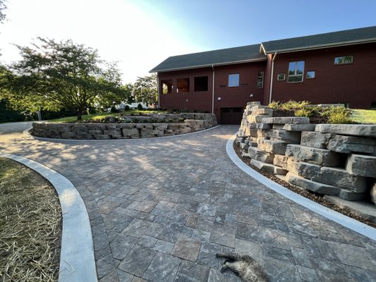 Front of house that leads traffic away from the garage door up and around to the main entrance