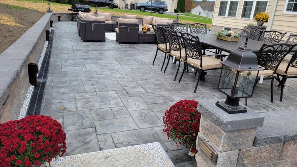 Stamped concrete patio and retaining wall