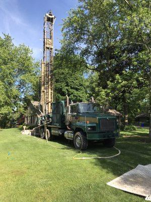 Well digging rig.